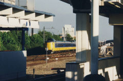 
NS train passing an Amsterdam Metro station, April 2003